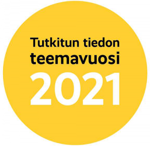 Kuvassa Tutkitun tiedon teemavuoden 2021 logo (keltainen ympyrä, jossa mustalla teksti: Tutkitun tiedon teemavuosi, valkoisella vuosiluku 2021.