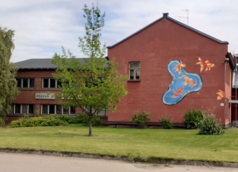 Building with mural on the wall.